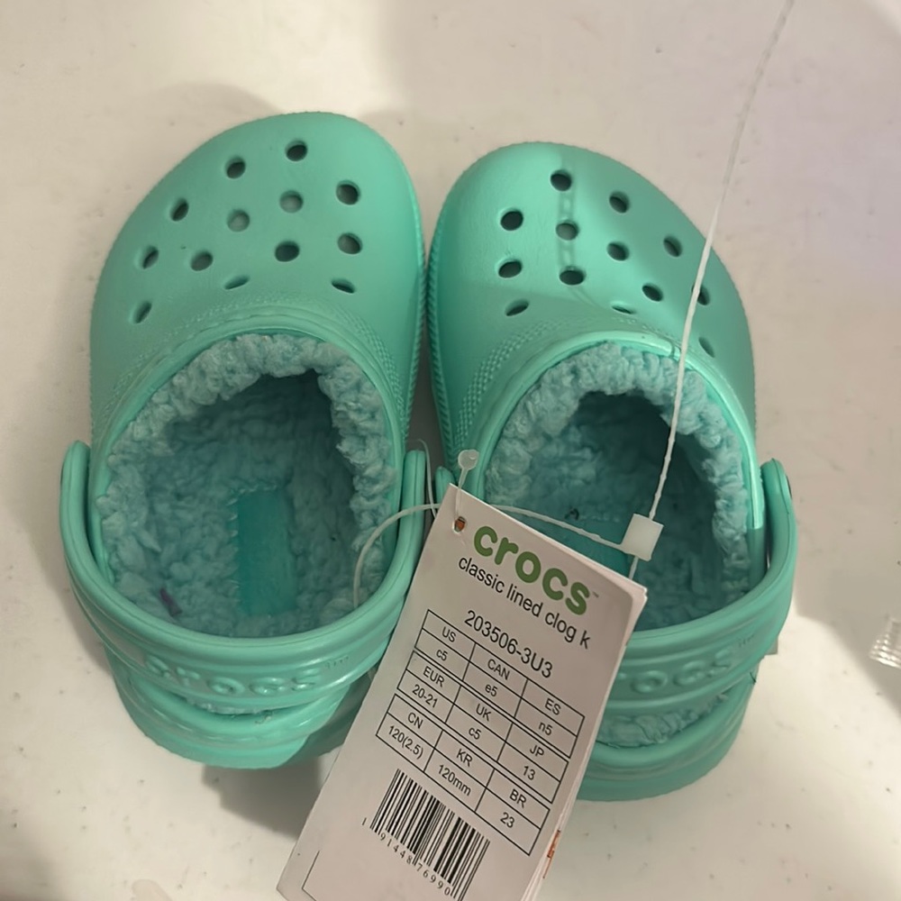 Light teal baby crocs size 5